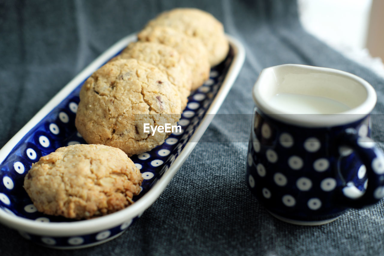 Homebaked oatmeal cookies and a jar of milk