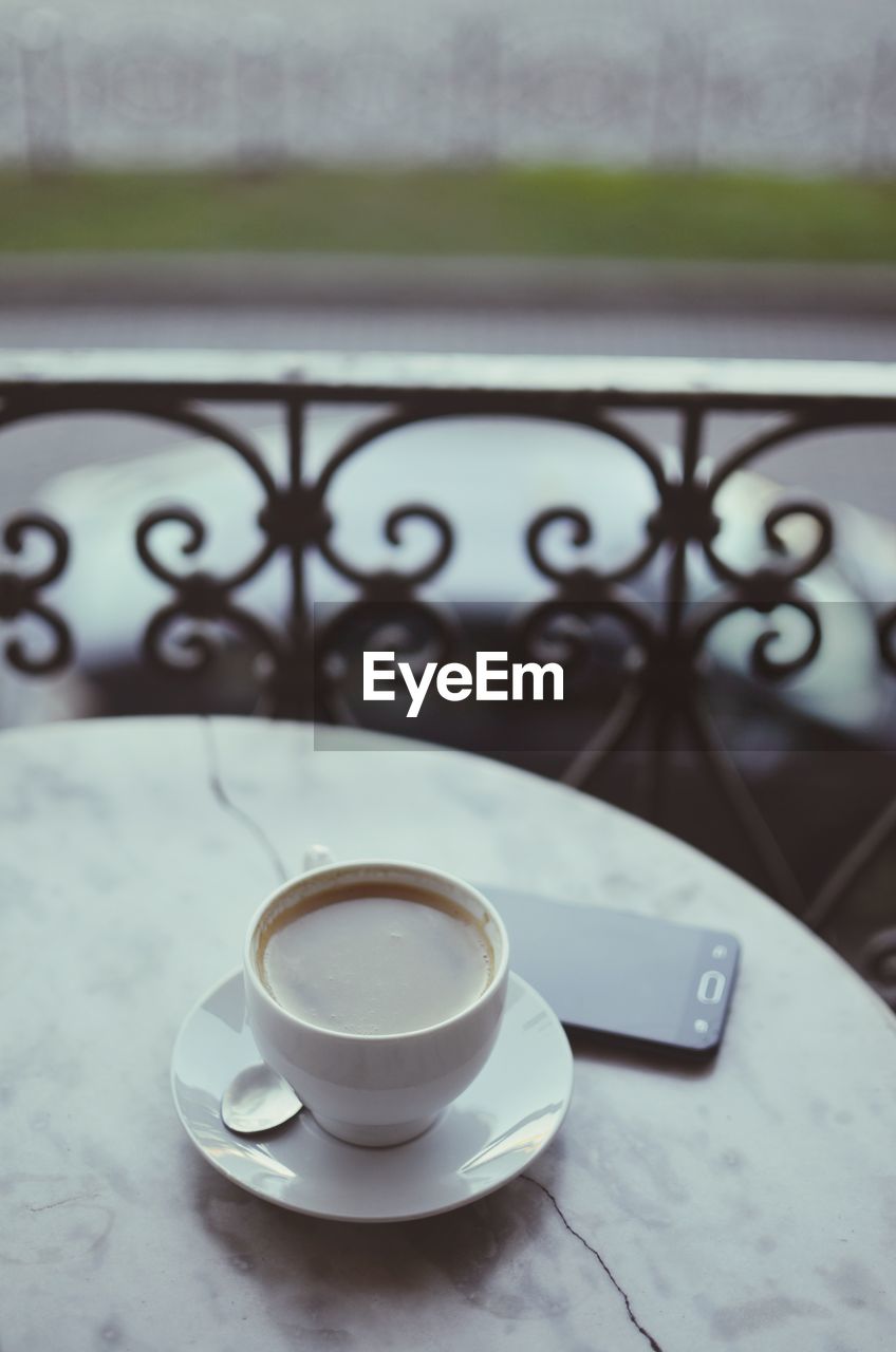 Close-up of coffee cup on table