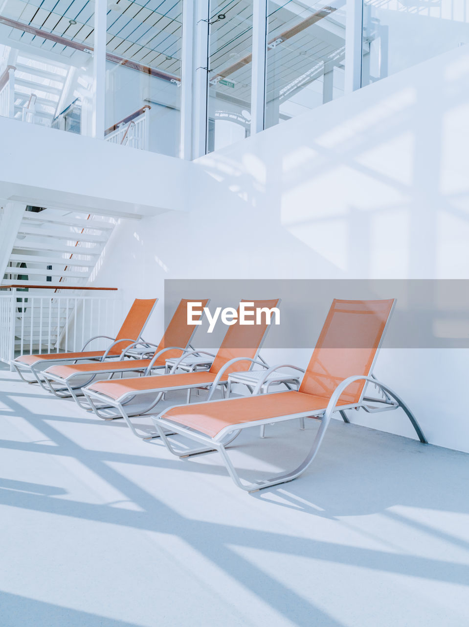 Empty chairs and table in office