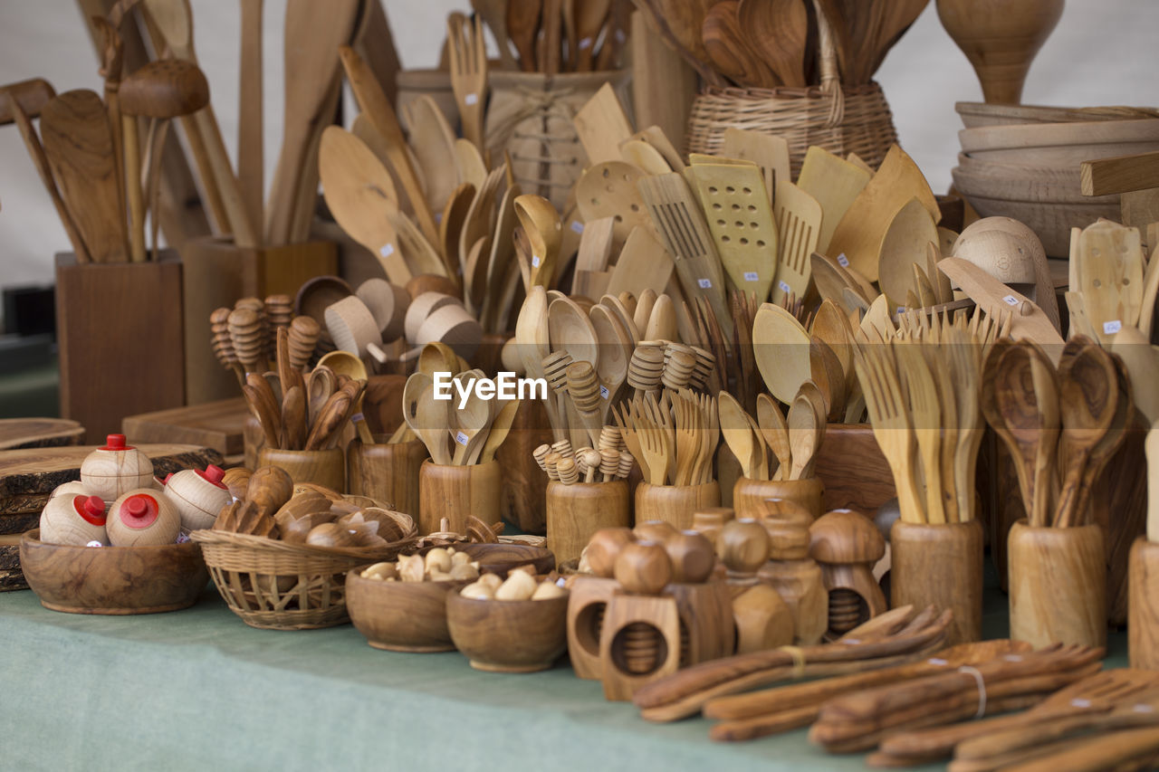 Wooden household equipment for sale at market stall