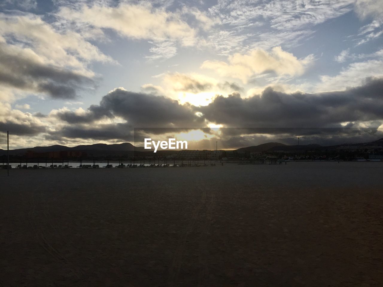 SCENIC VIEW OF BEACH DURING SUNSET