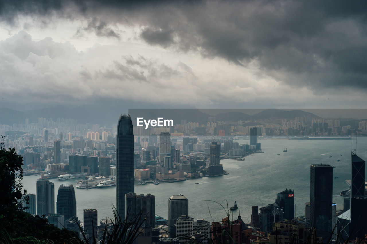 City skyline against cloudy sky