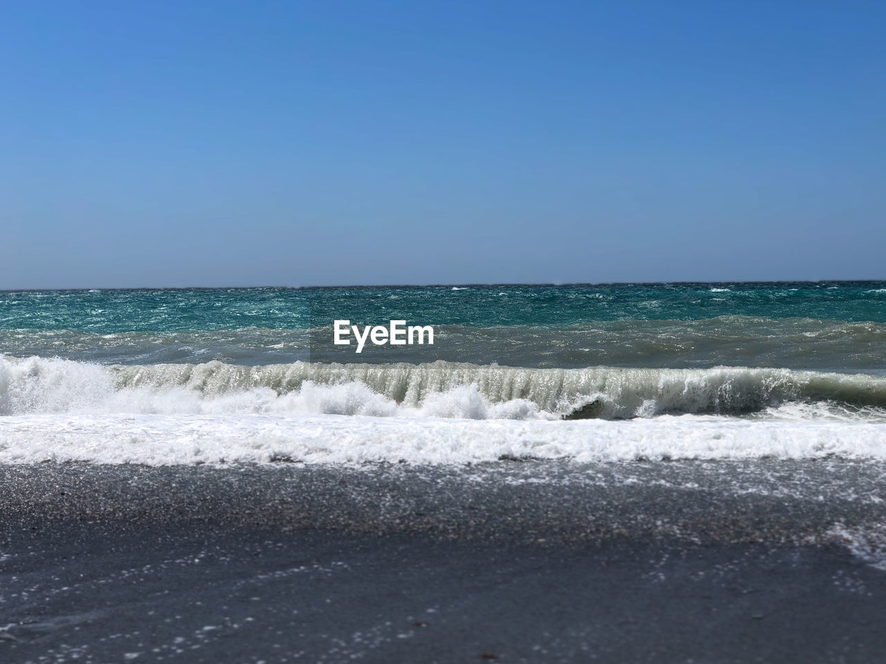 SCENIC VIEW OF BEACH AGAINST CLEAR SKY