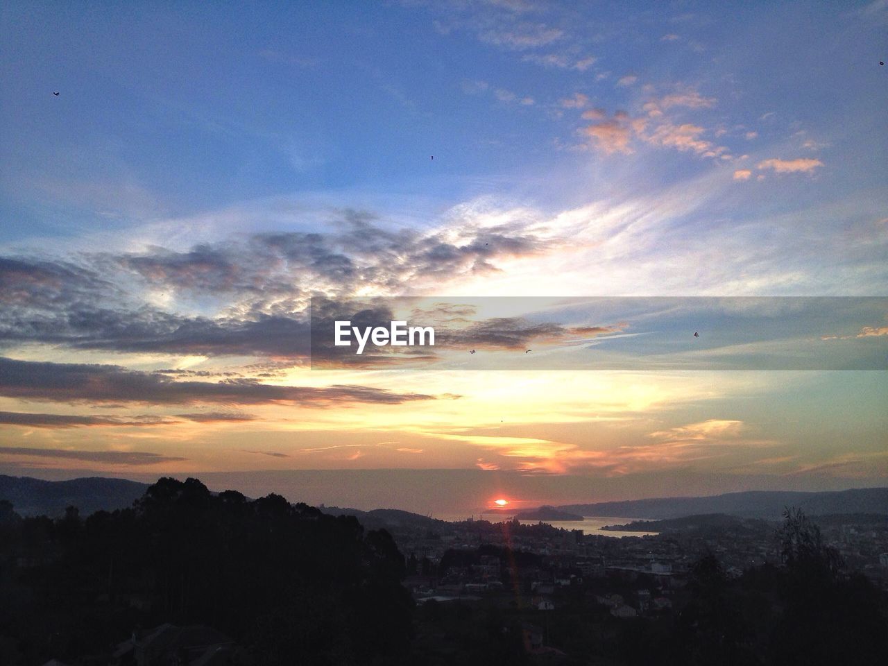 Scenic view of mountains against sky during sunset