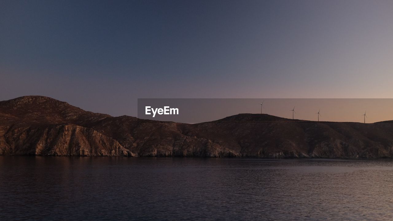 SCENIC VIEW OF RIVER AGAINST MOUNTAINS