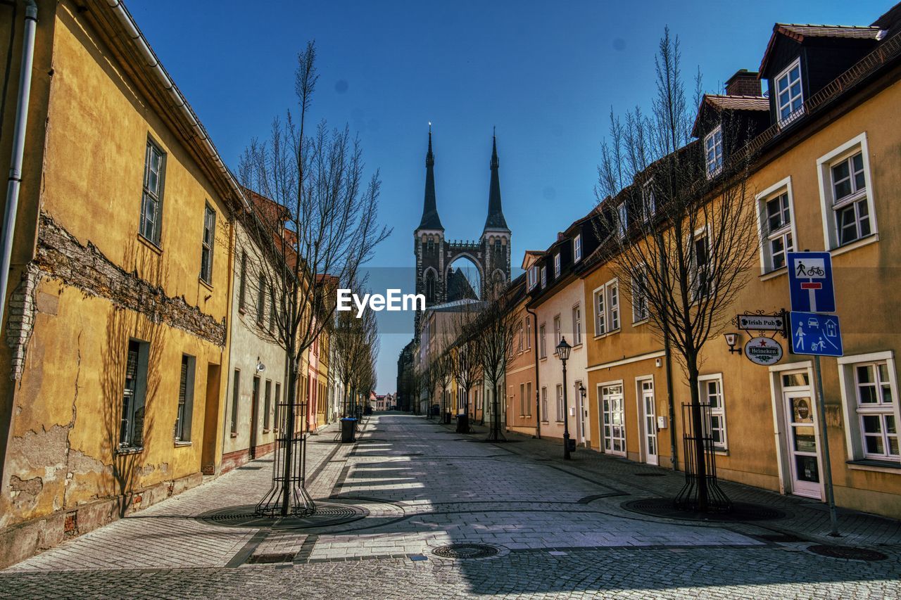 STREET AMIDST BUILDINGS IN CITY