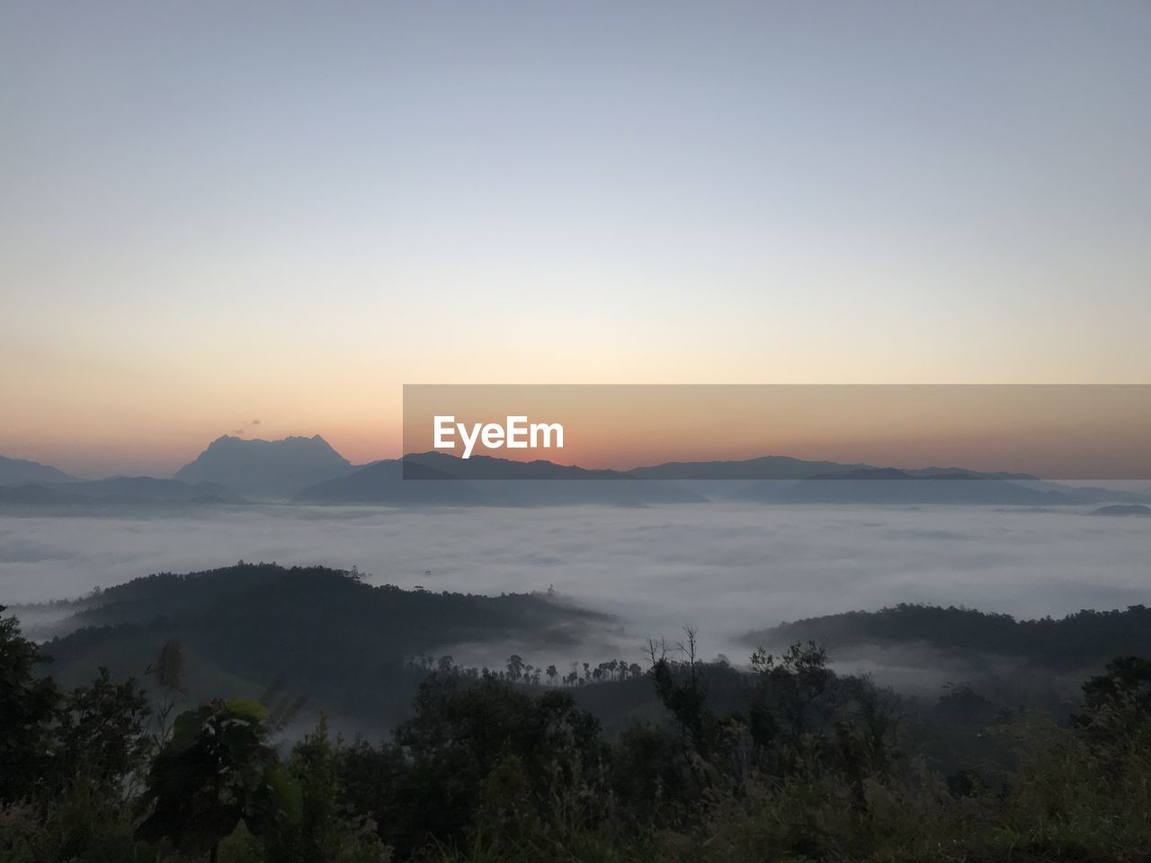 Scenic view of mountains against sky during sunset