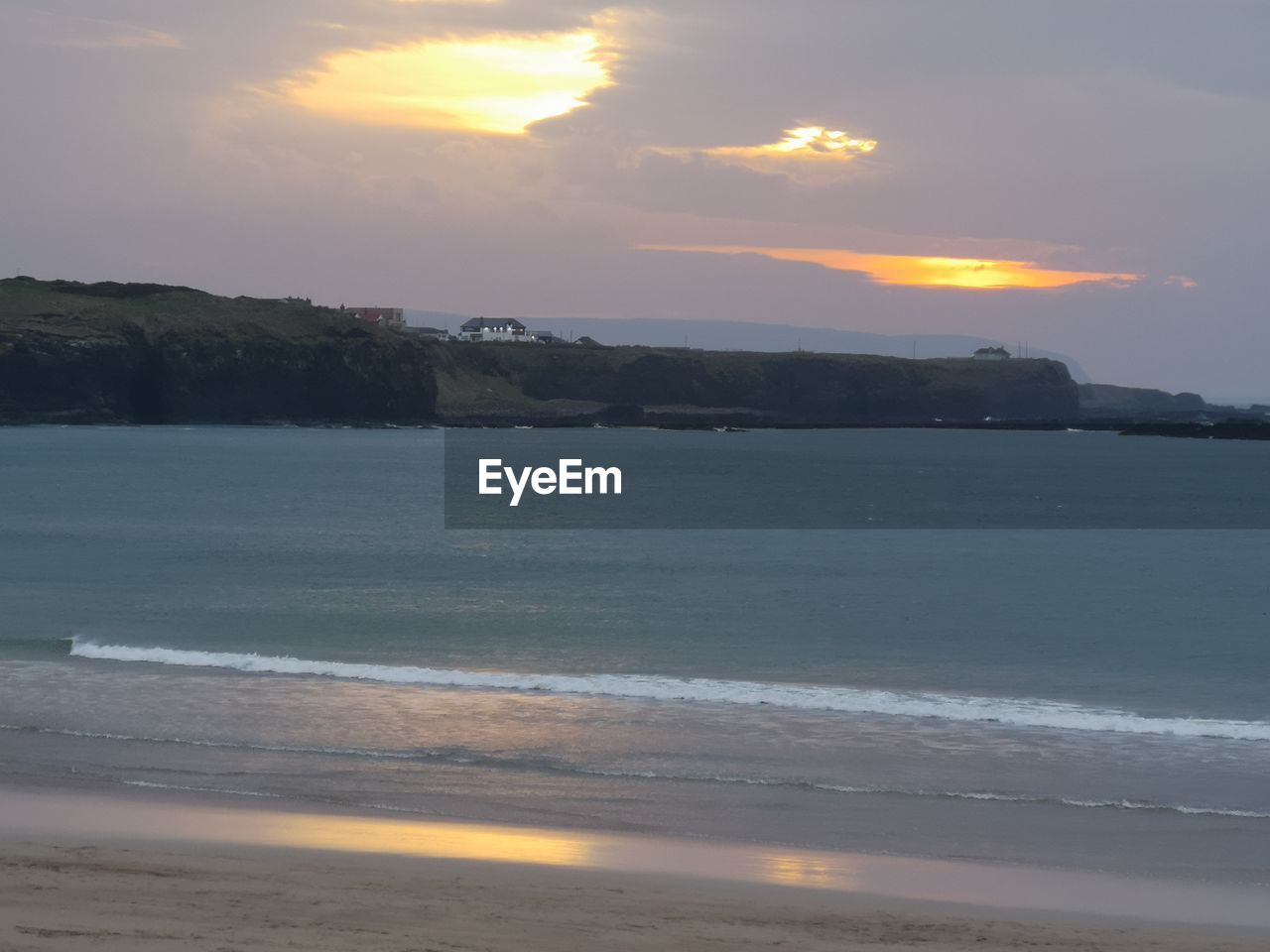 SCENIC VIEW OF SEA DURING SUNSET
