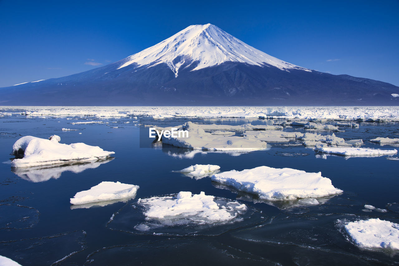 A composite photo mt.fuji and drift ice
