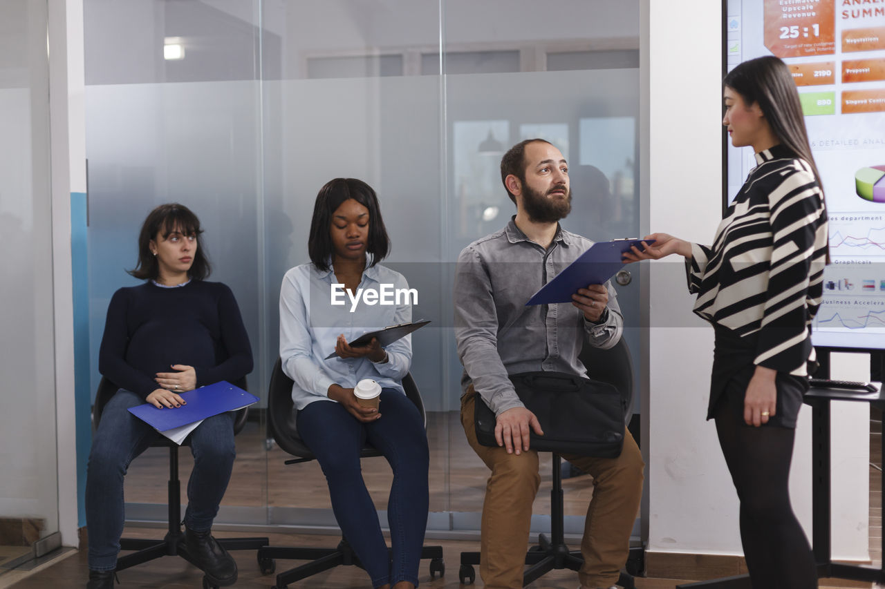 Group of business colleagues working in office