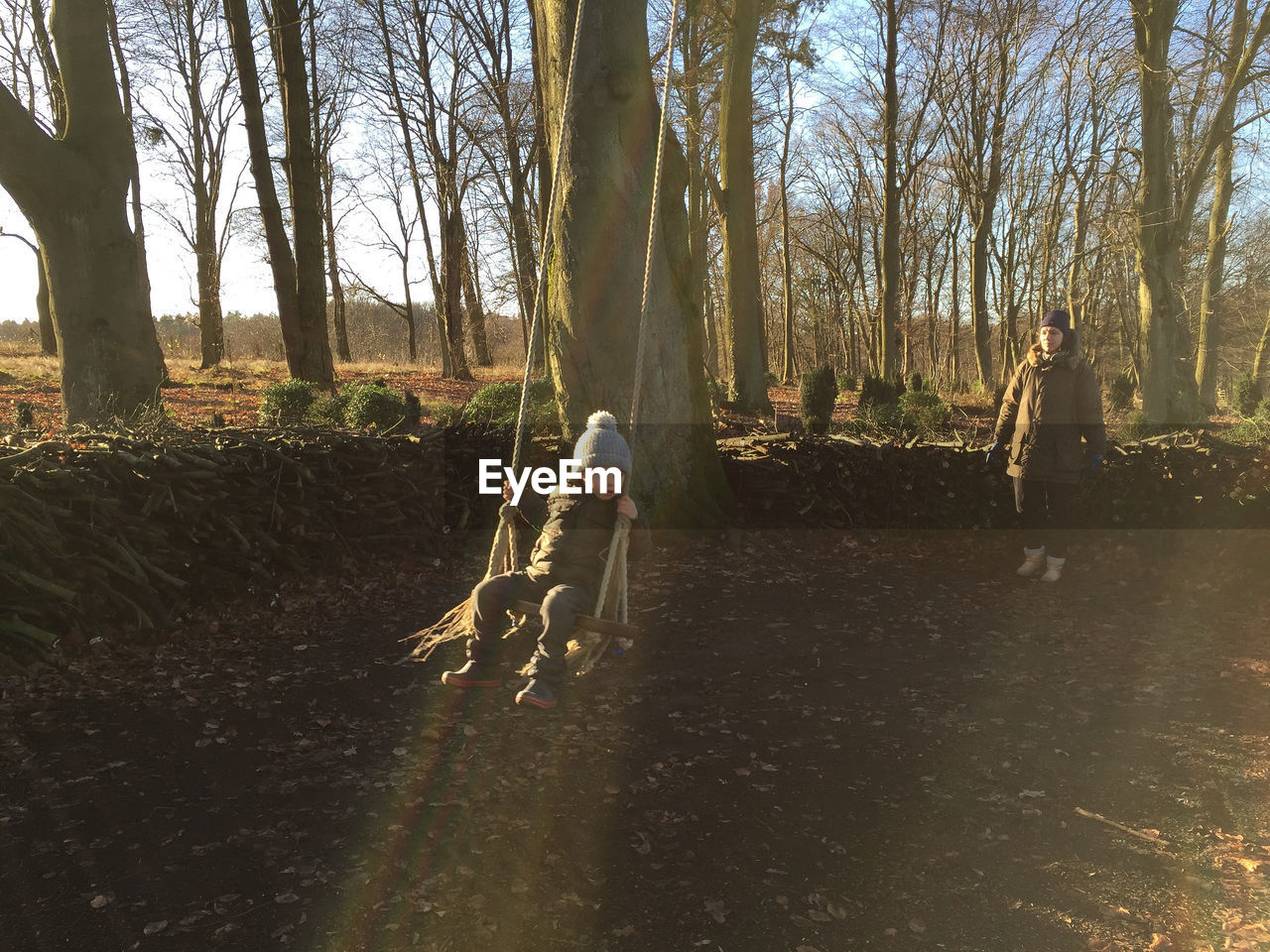 Boy on swing at park