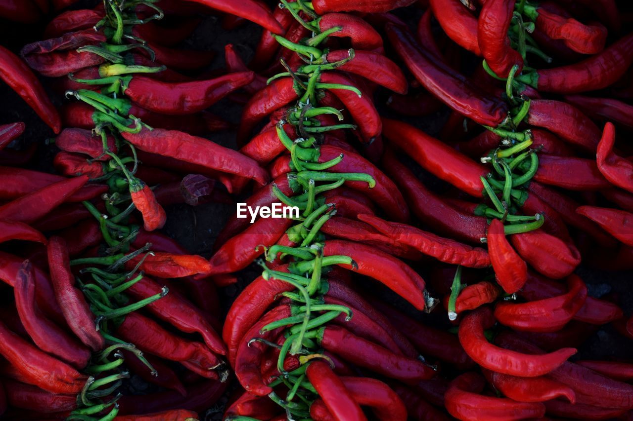 Full frame shot of red chili peppers for sale at market