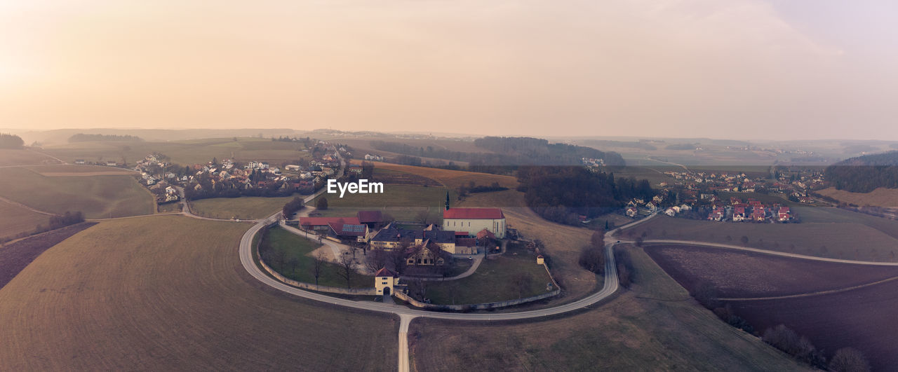 HIGH ANGLE VIEW OF ROAD AGAINST SKY