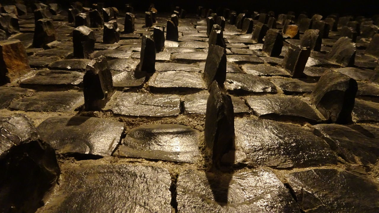 SHADOW OF SUNLIGHT ON STONE