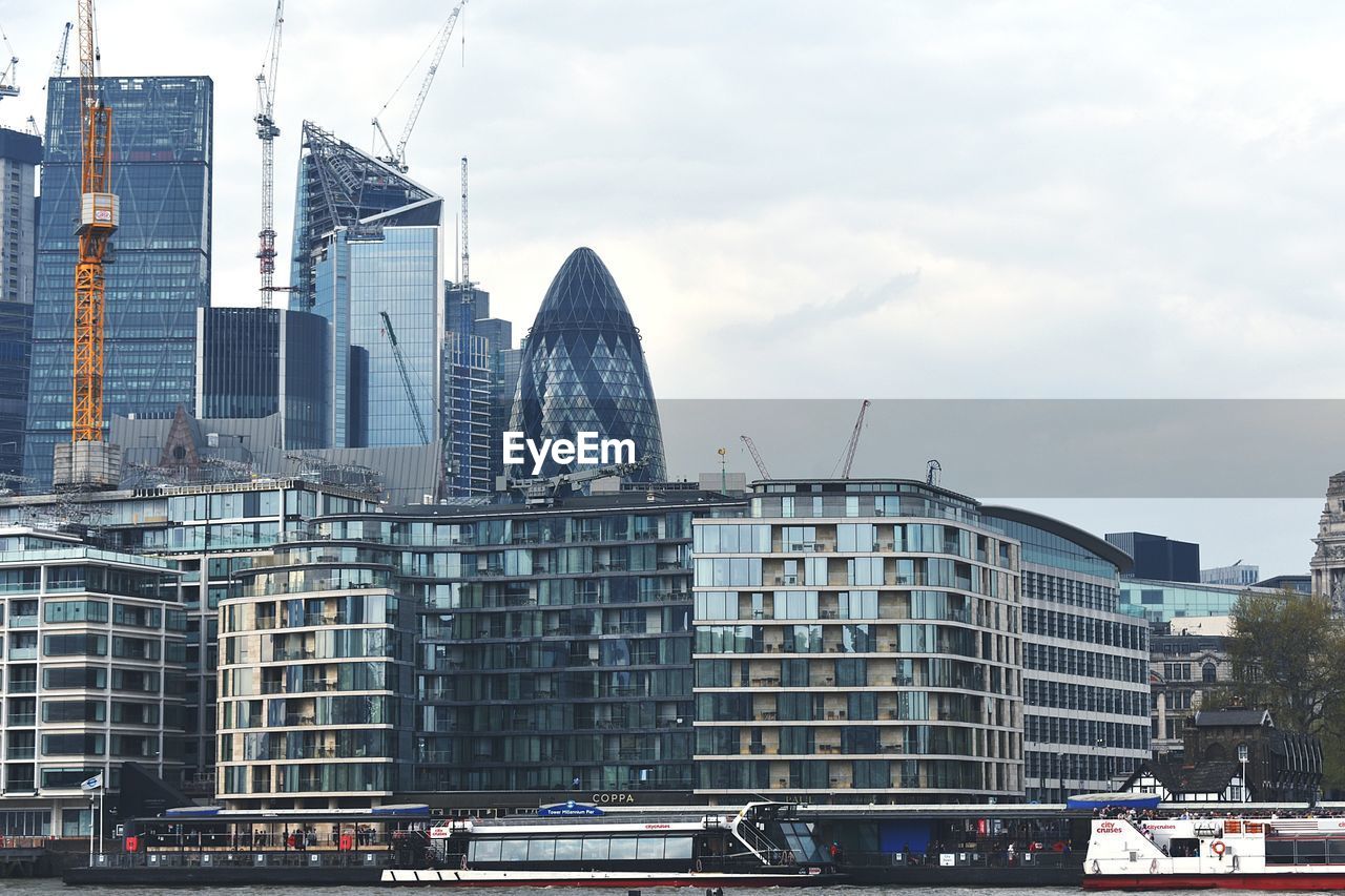 Modern buildings against sky in city