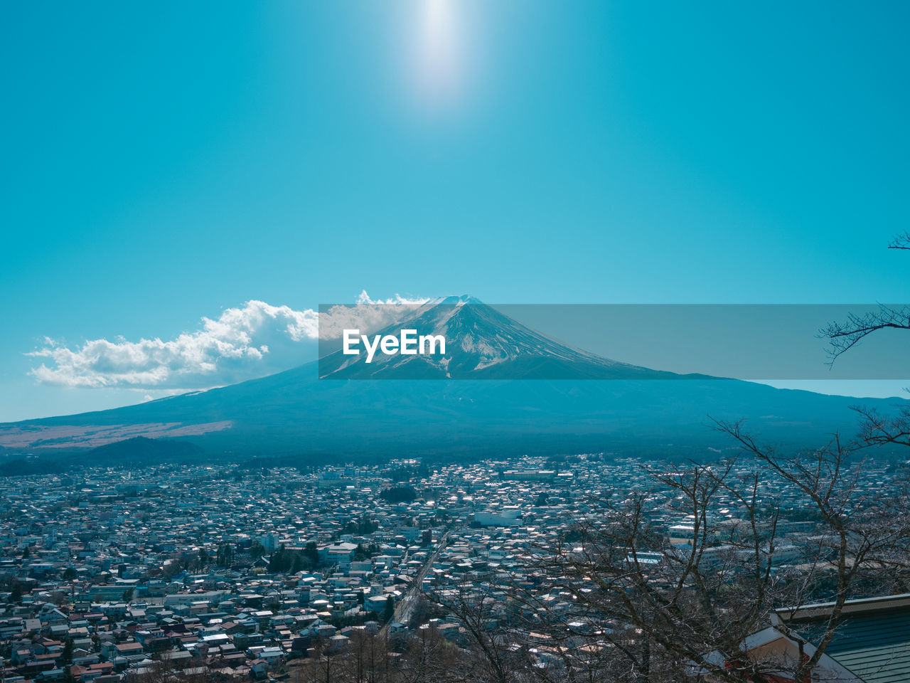 Scenic view of snowcapped mountains against blue sky