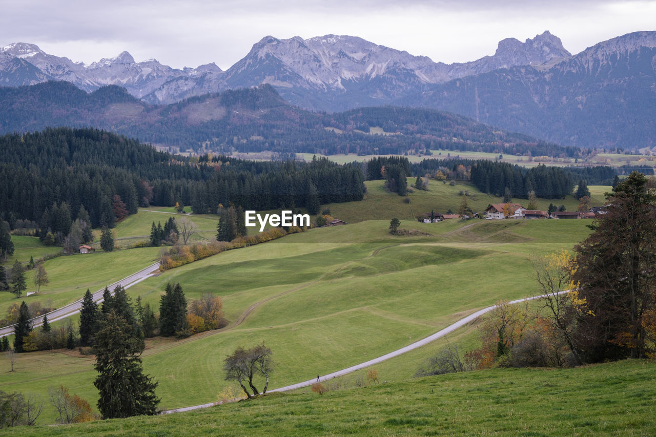 Scenic view of landscape and mountains against sky