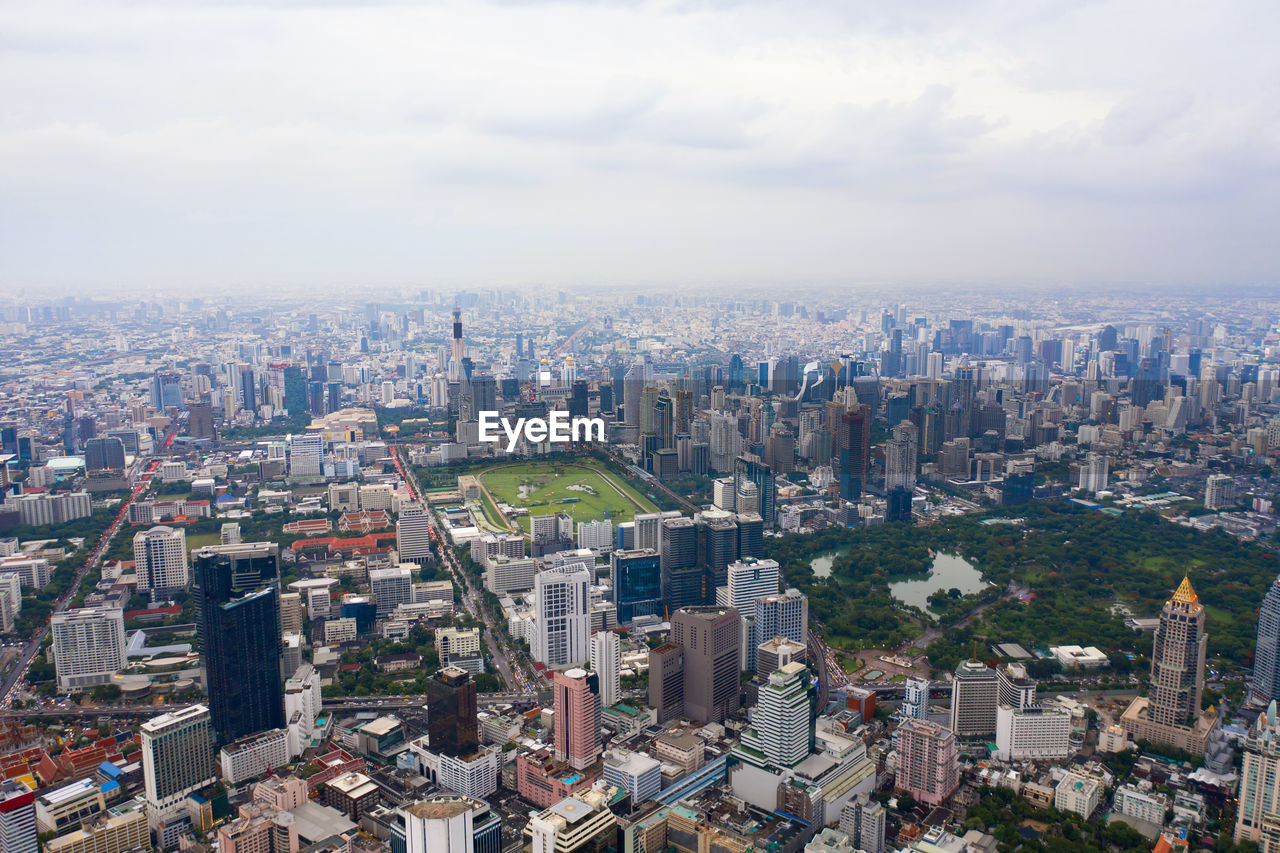 High angle view of modern buildings in city against sky