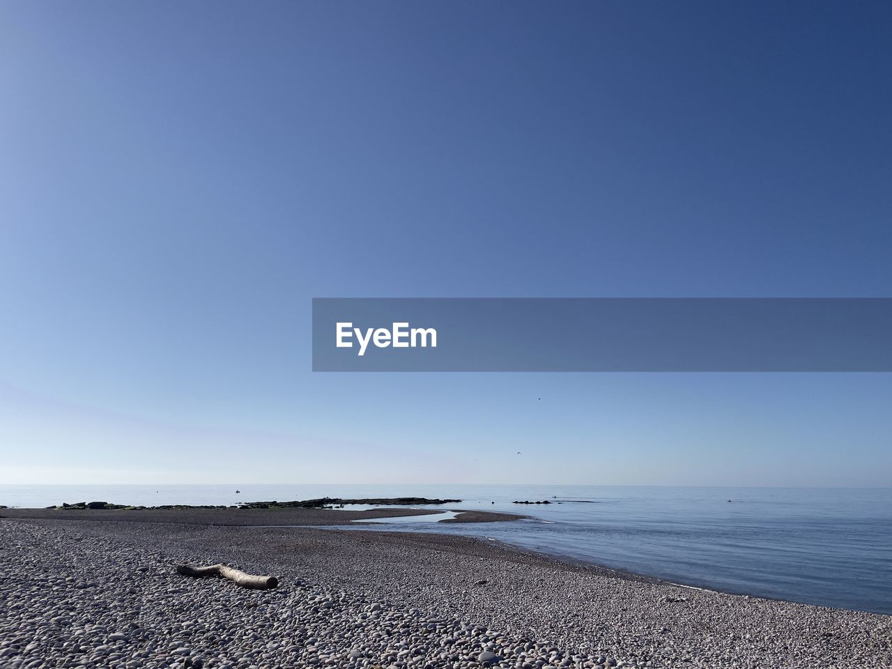 SCENIC VIEW OF BEACH AGAINST CLEAR SKY