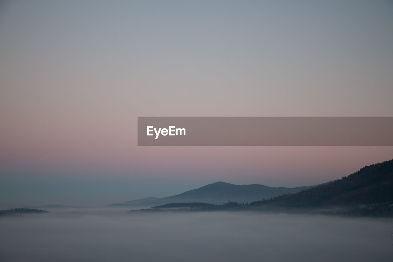 Scenic view of mountains against sky during sunset