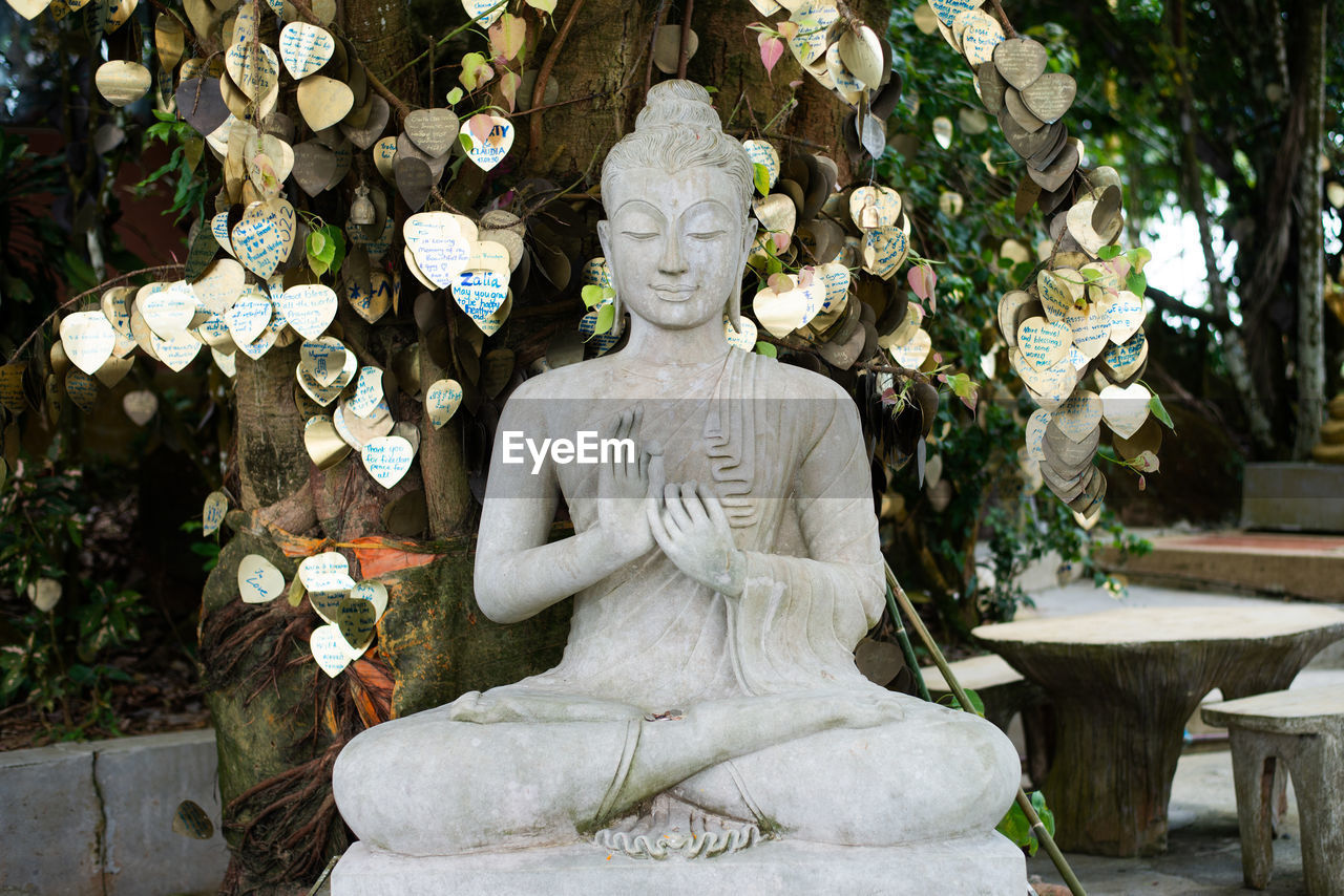 sculpture, statue, religion, human representation, representation, spirituality, creativity, belief, monument, craft, plant, male likeness, temple, no people, nature, furniture, temple - building, tree, architecture, art, zen-like, day, outdoors, tranquility, flower