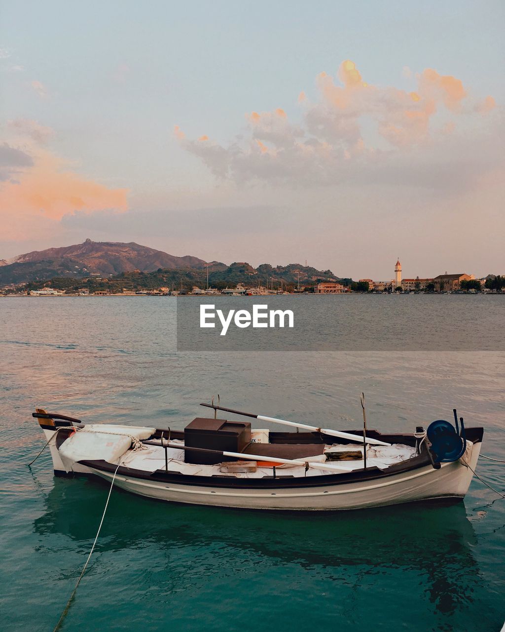 Boats moored on sea against sky