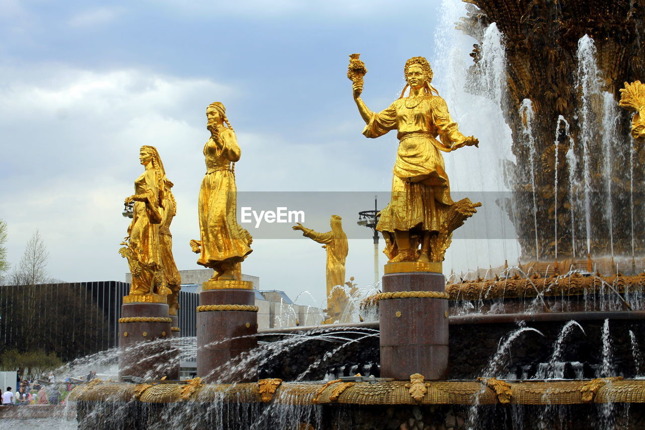 LOW ANGLE VIEW OF STATUE ON FOUNTAIN