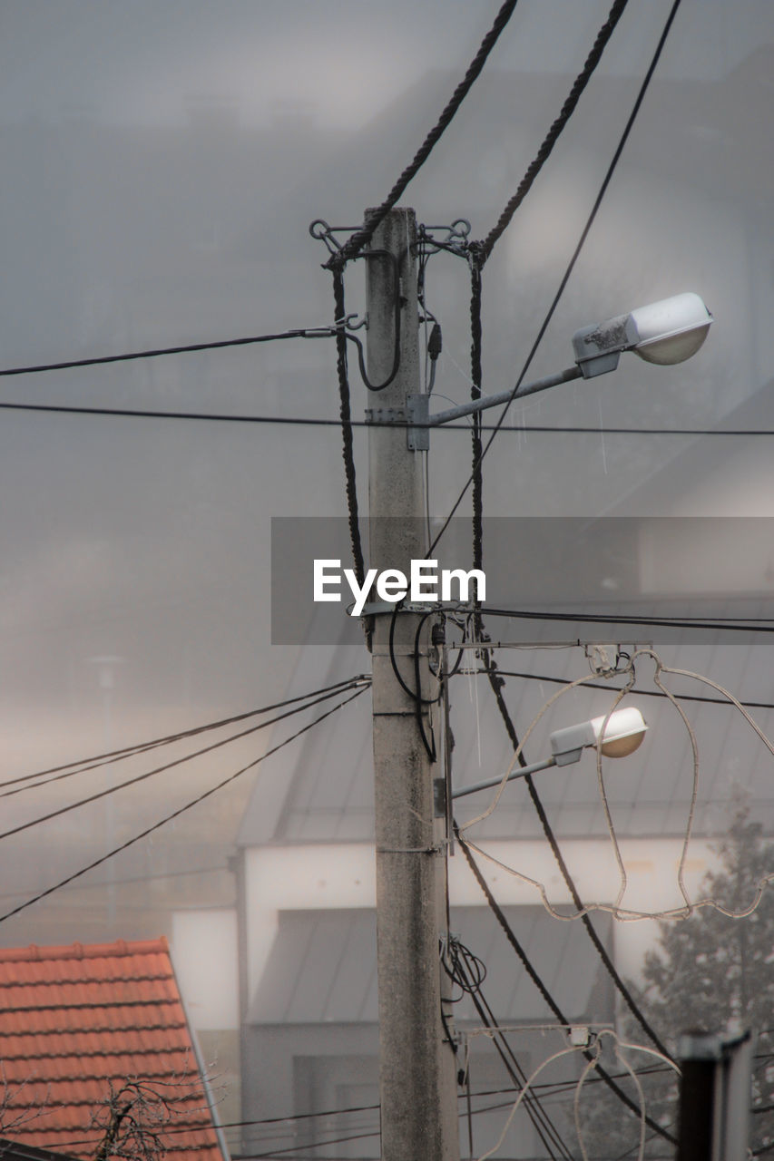 LOW ANGLE VIEW OF POWER LINES AGAINST SKY