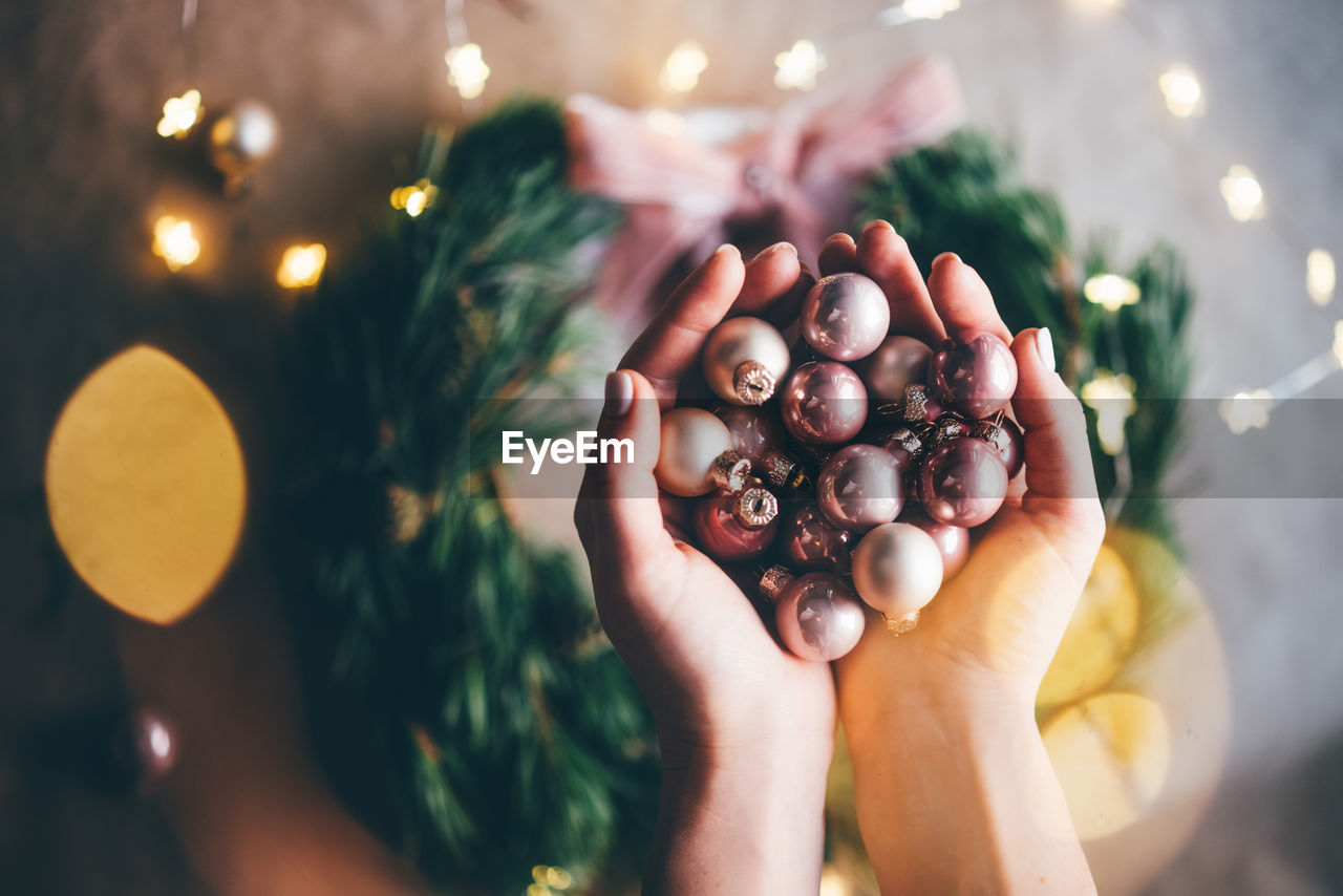 Close-up of hand holding baubles