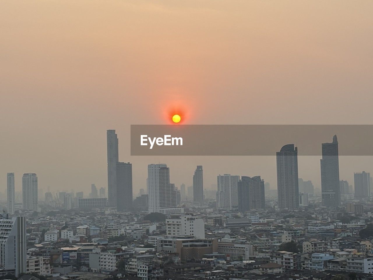 city, architecture, building exterior, built structure, sky, landscape, horizon, cityscape, urban skyline, skyscraper, building, office building exterior, sunset, skyline, nature, residential district, dawn, city life, no people, sun, downtown district, travel destinations, metropolitan area, sunlight, outdoors, fog, haze, evening, high angle view, environment, dramatic sky, development, metropolis, cloud, transportation, street