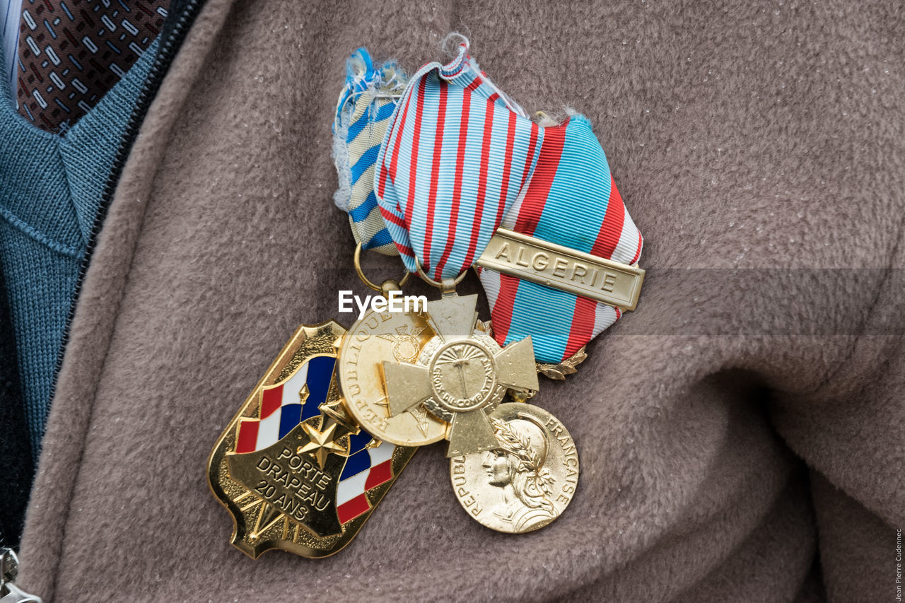 Midsection of male soldier wearing medals