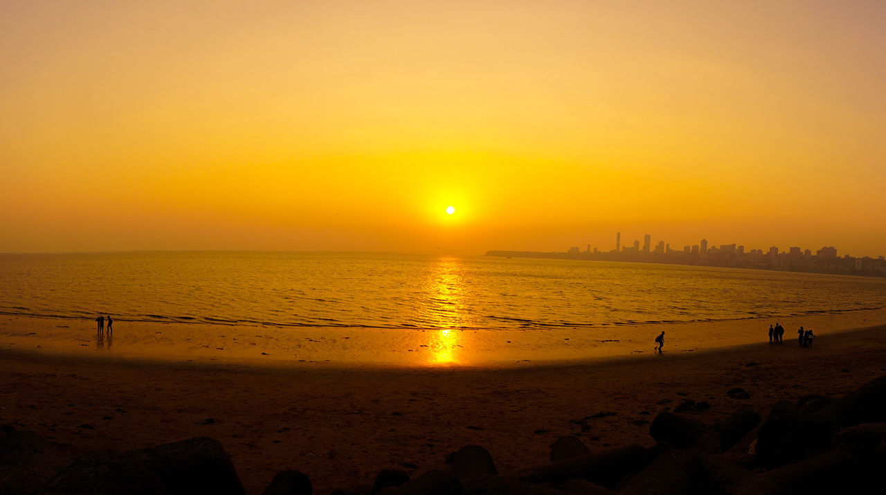 SCENIC VIEW OF BEACH DURING SUNSET