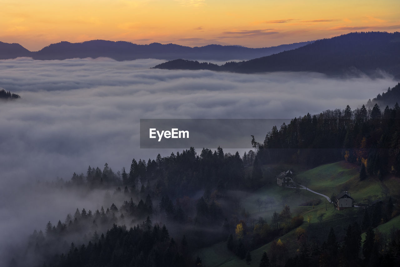 Scenic view of mountains against sky during sunset