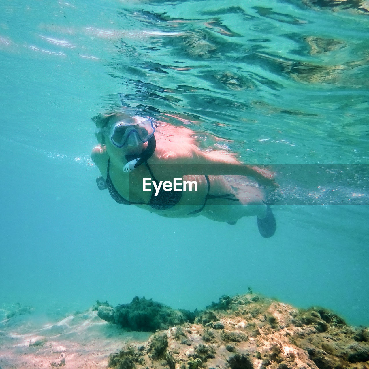 Woman swimming in sea