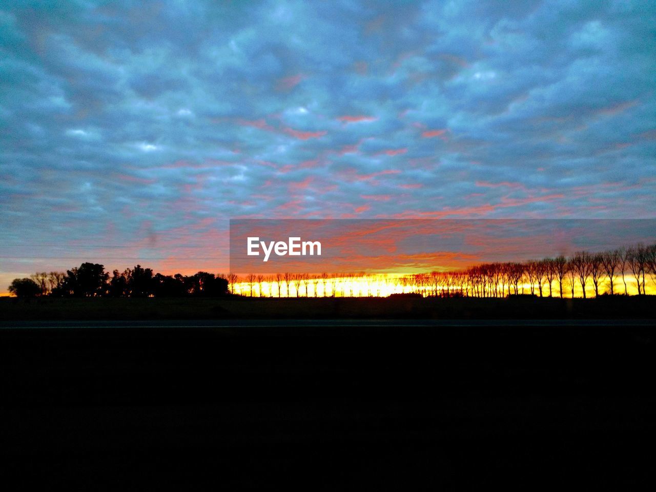 SILHOUETTE LANDSCAPE AGAINST SKY DURING SUNSET