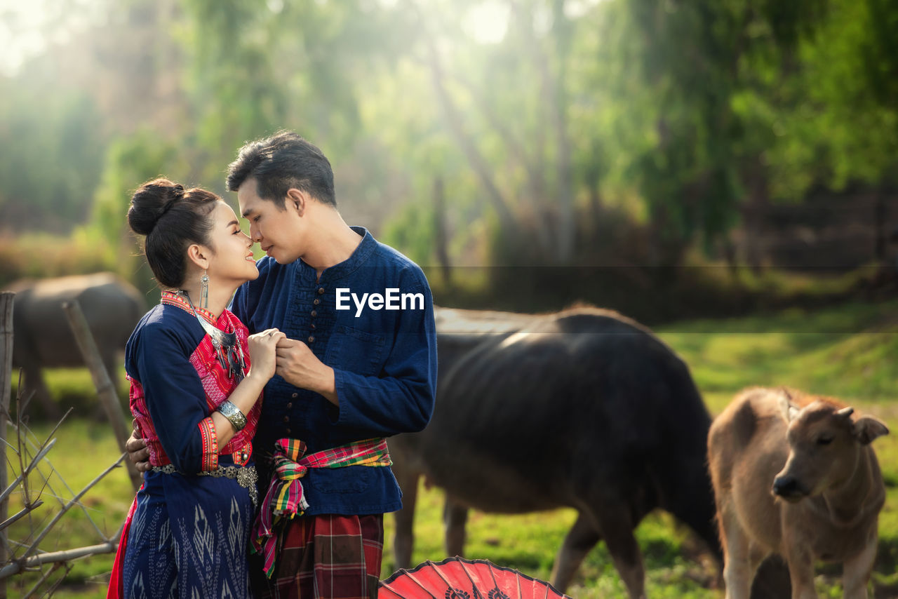 Pre wedding shoot inside garden in thai traditional dress costumes