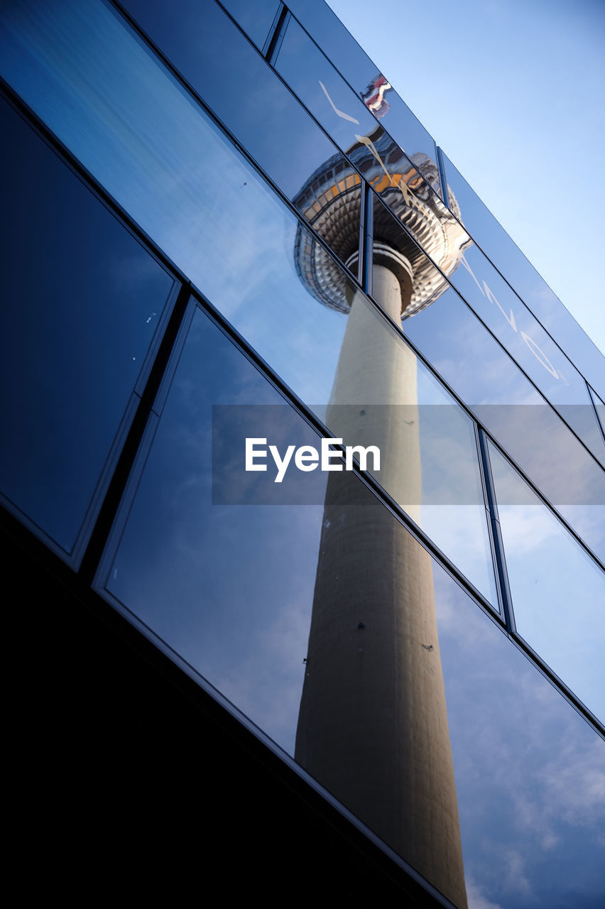 Reflection of berlin tower on glass building