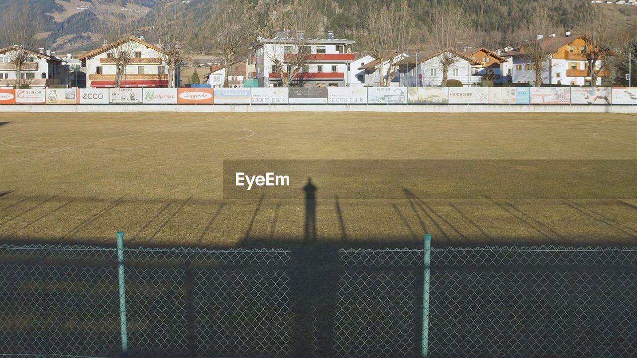 Shadow of man on soccer field