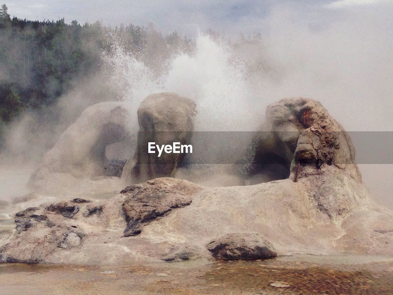 Water splashing on rocks at yellowstone national park