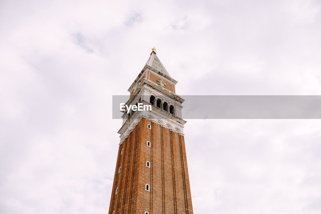 LOW ANGLE VIEW OF A CLOCK TOWER