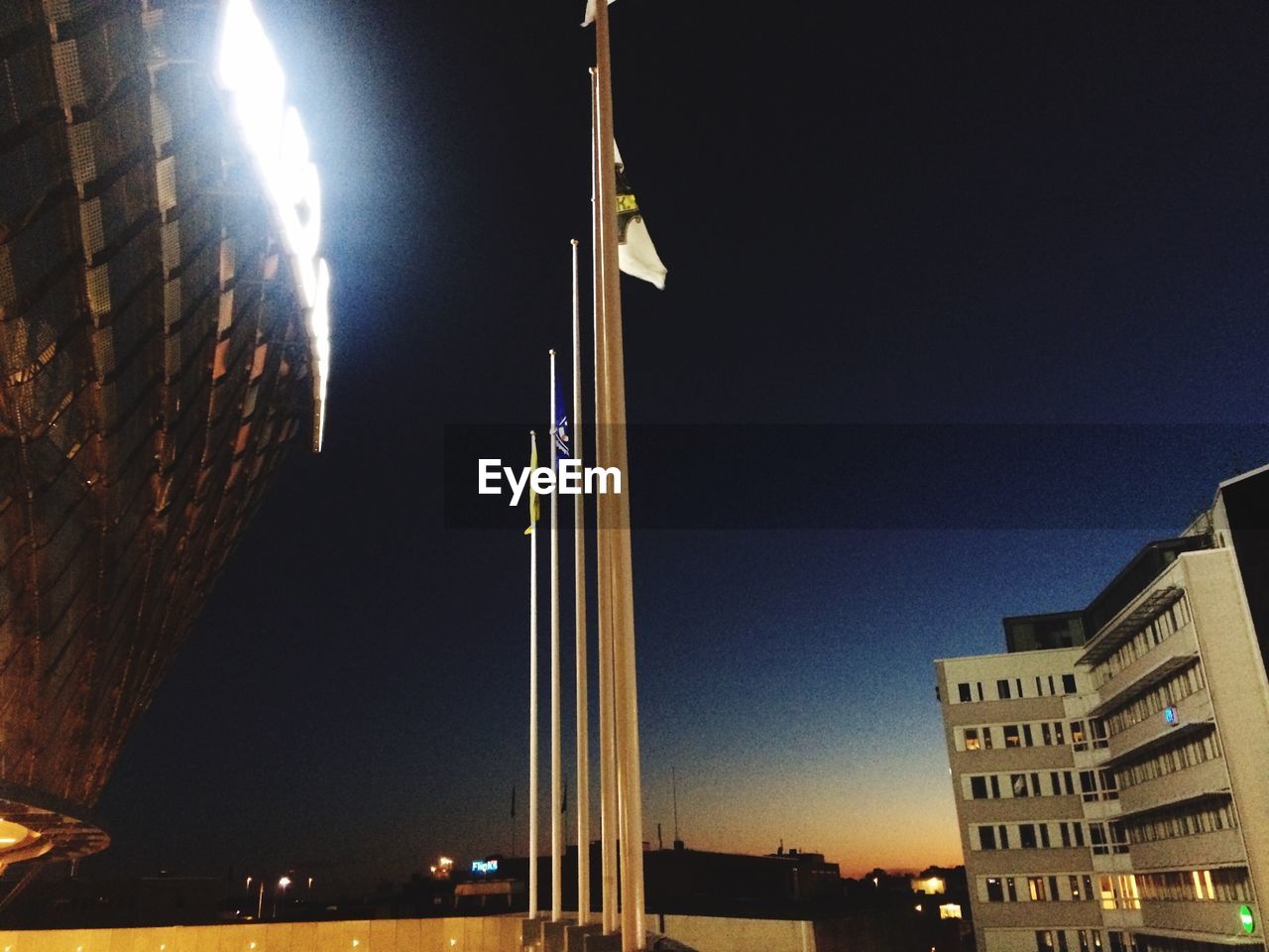 LOW ANGLE VIEW OF ILLUMINATED STREET LIGHT AT NIGHT