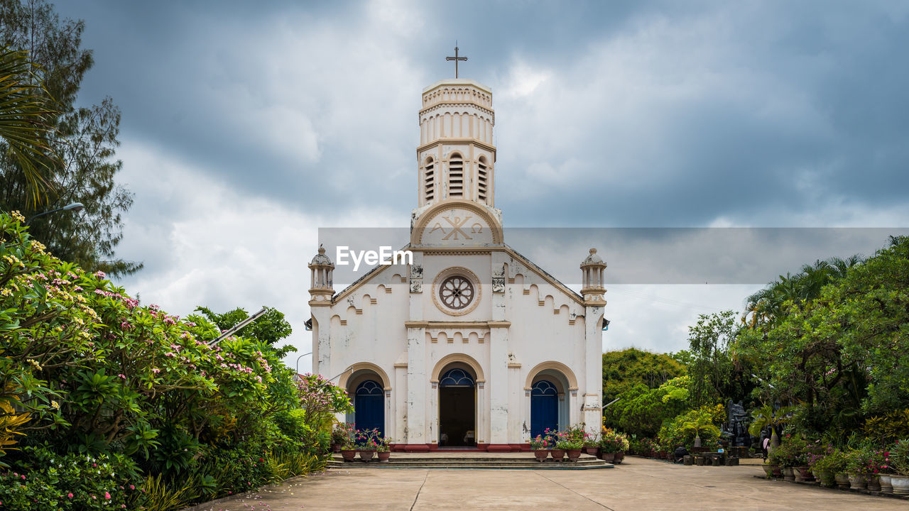 View of church and building against sky