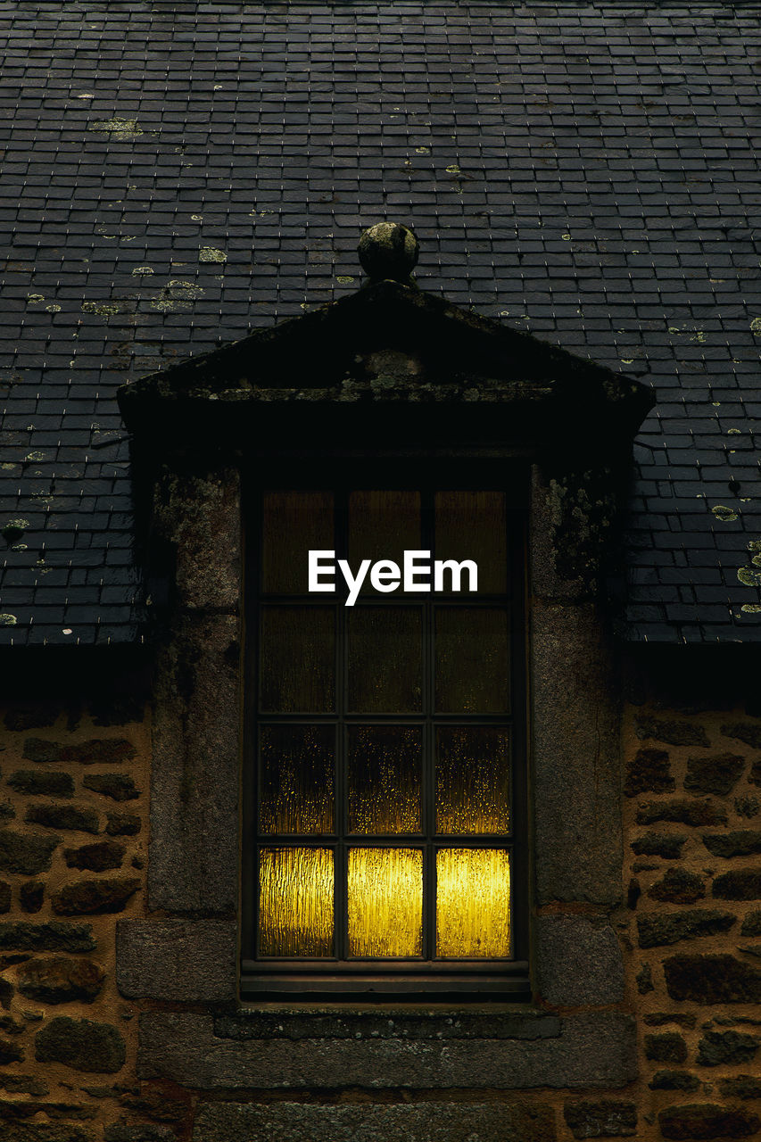 Window lit in the dark, locronan-france