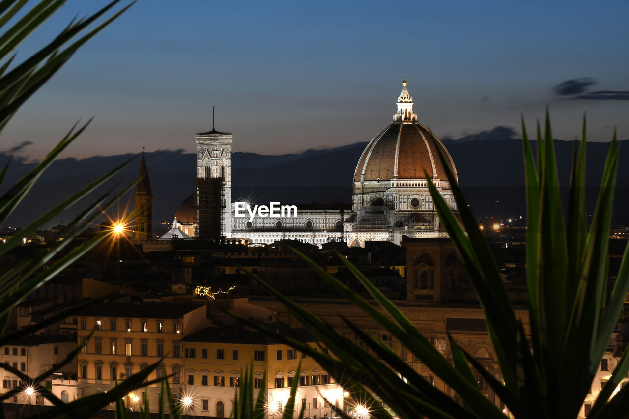 HIGH ANGLE VIEW OF ILLUMINATED BUILDINGS AGAINST SKY