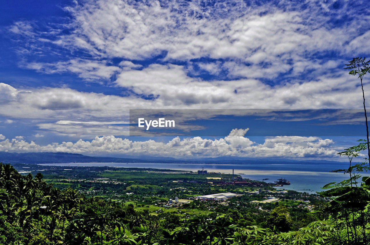 SCENIC VIEW OF SEA AND CITYSCAPE AGAINST SKY