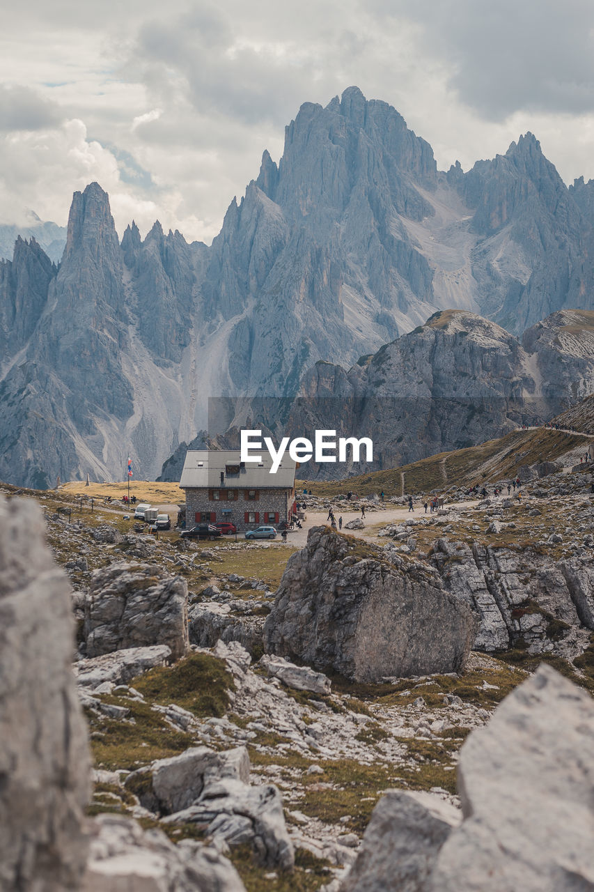 SCENIC VIEW OF MOUNTAINS AND ROCKS AGAINST SKY