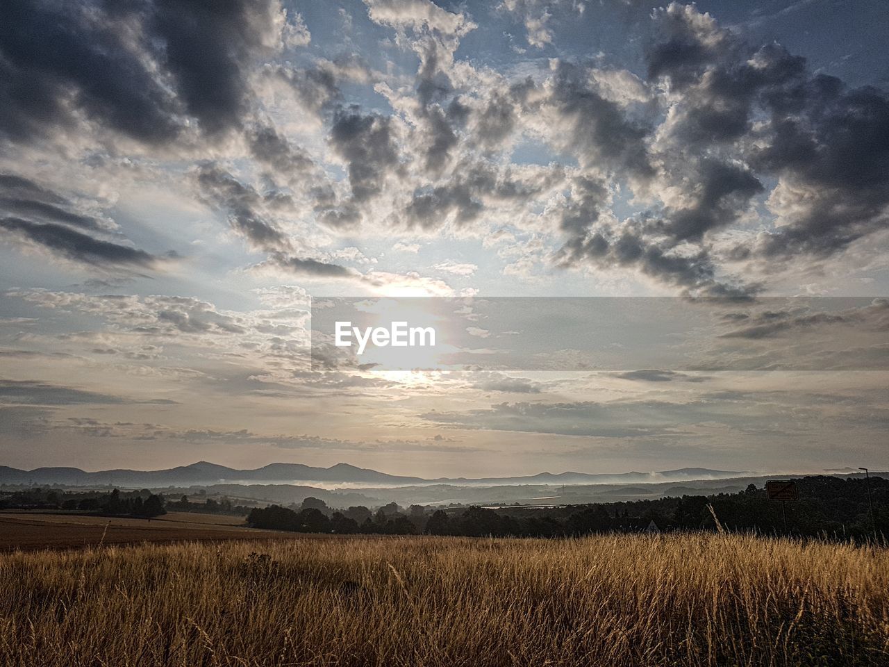 SCENIC VIEW OF LANDSCAPE AGAINST SKY DURING SUNSET