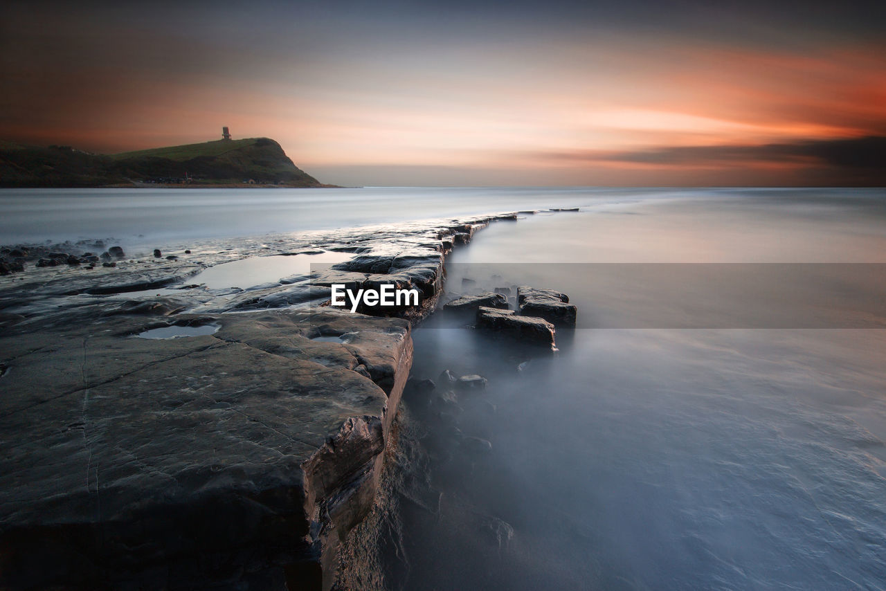 Scenic view of sea against sky during sunset