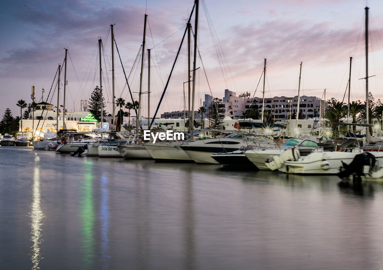 Boats moored at harbor