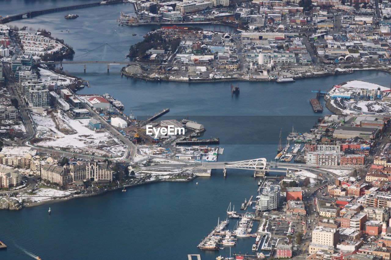 High angle view of sea and buildings in city